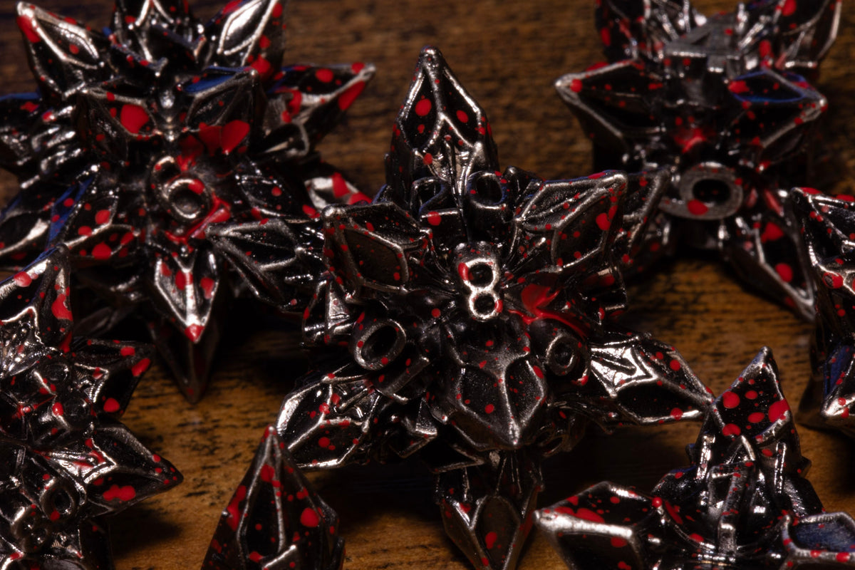 Blooming Stars 7-Piece Metal Dice Set – Antique Silver with Red Splatter