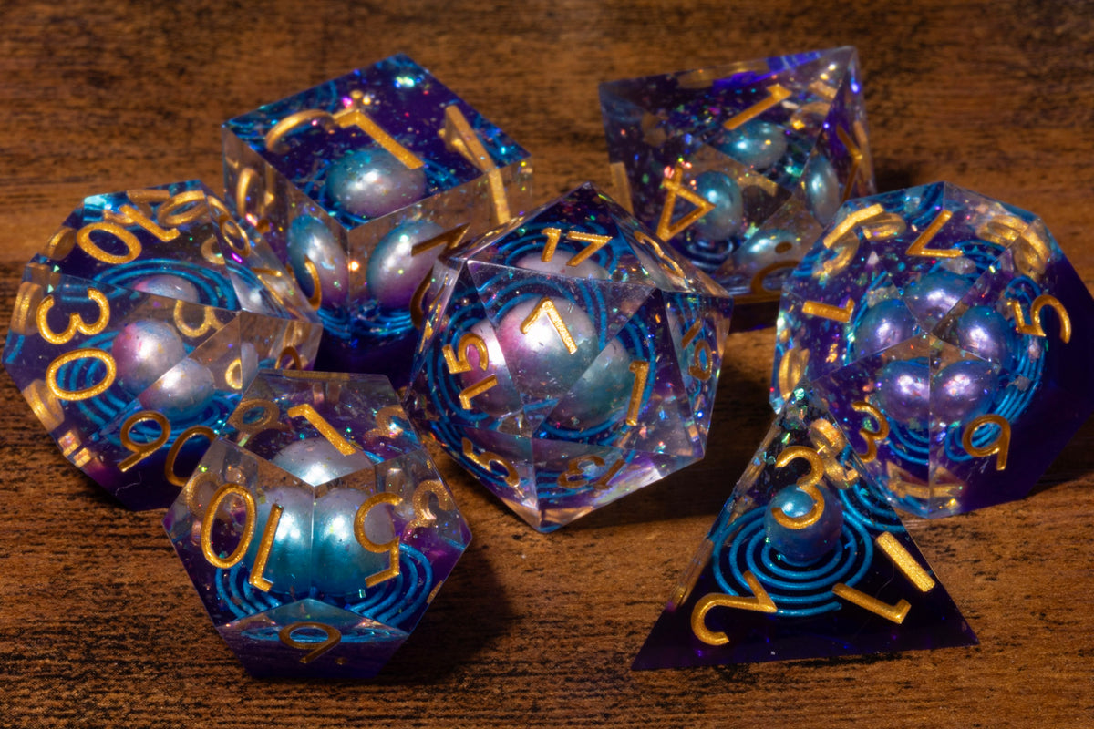 Wandering Star 7-Piece Sharp Edge Dice Set – Clear Iridescent with Planet Inclusion