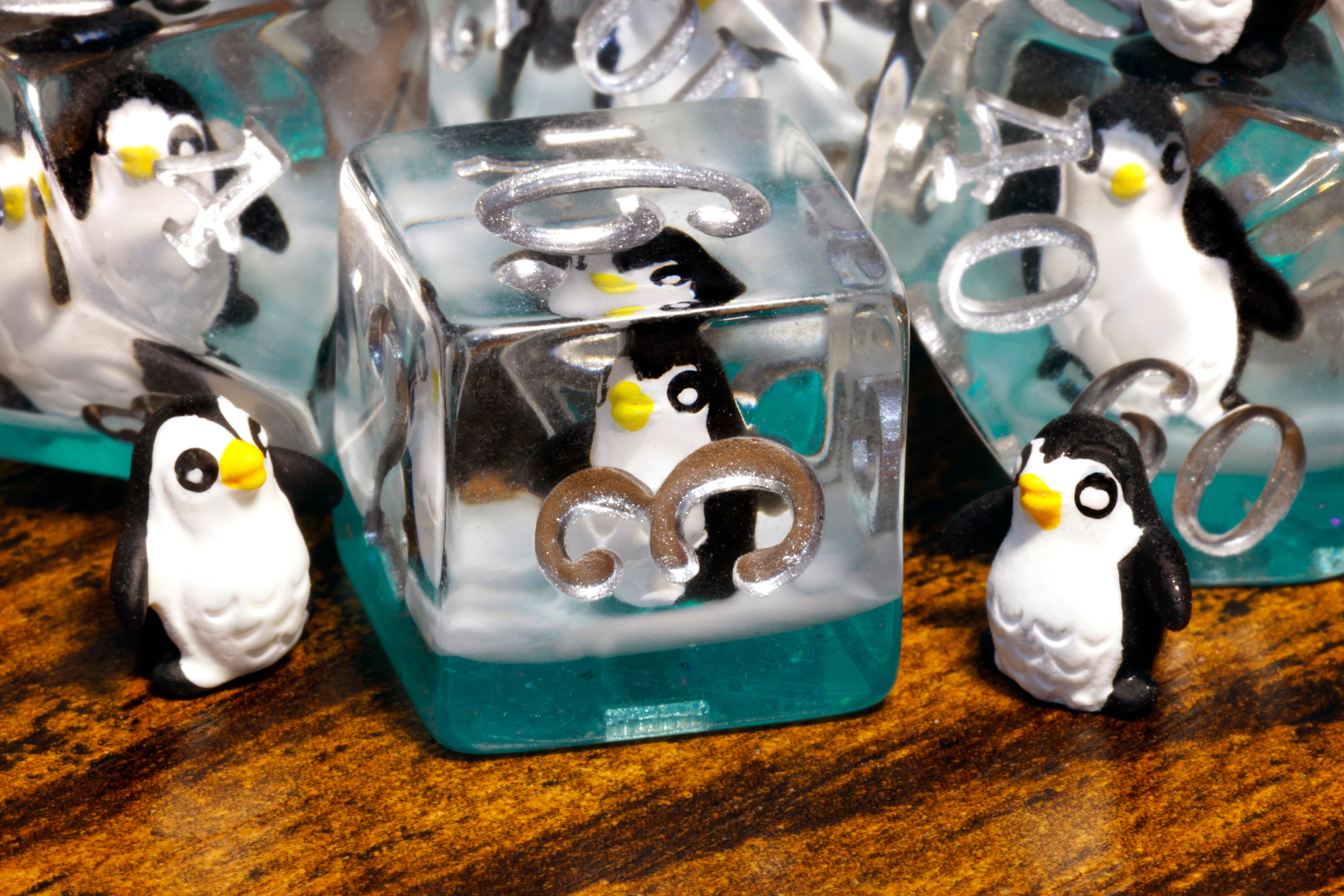 a group of penguin figurines sitting on top of a table