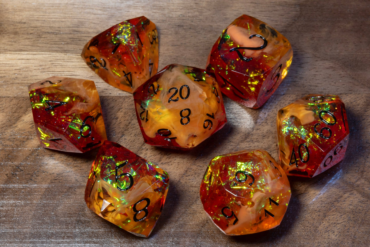 Amber Opal sharp-edge dice set in amber and orange-red resin with holographic foil on wood