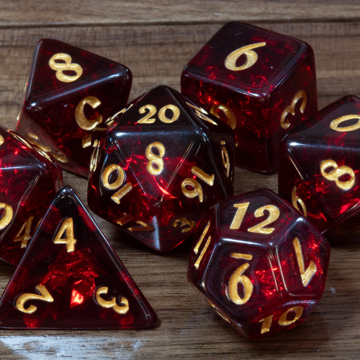 Close-up of Cherry Opal dice, dark red resin with holographic inclusions