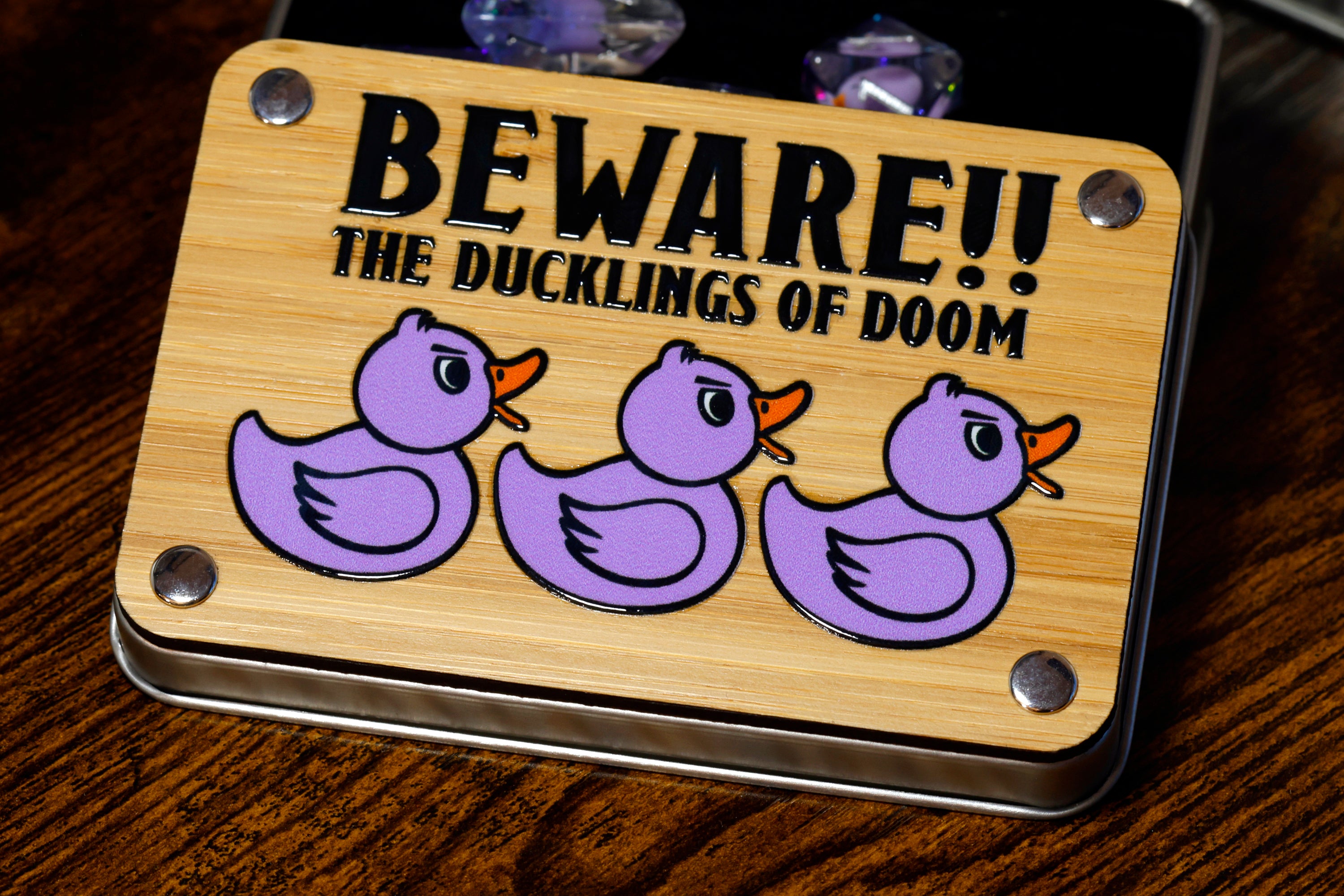 a wooden sign that says beware the ducklings of dom