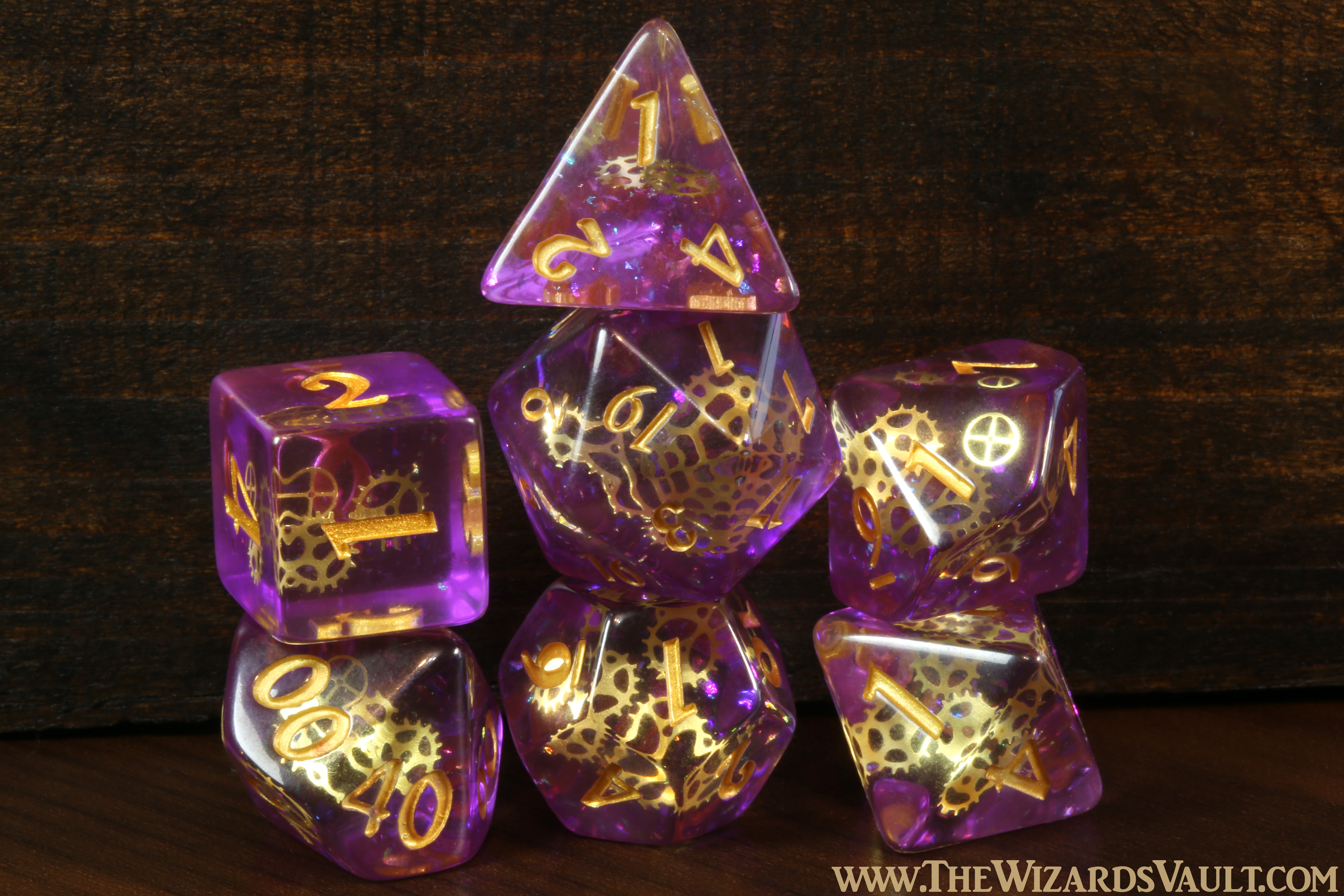 Arcane Sprockets - Dice with tiny golden gears on a purple glittery layer. - The Wizard's Vault