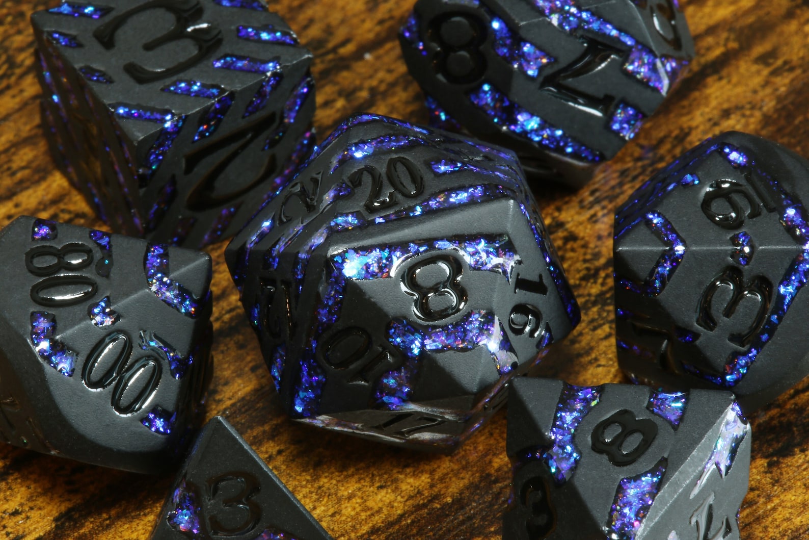 Rift Artifact - Heavy black metal dice with iridescent blue stripe - The Wizard's Vault