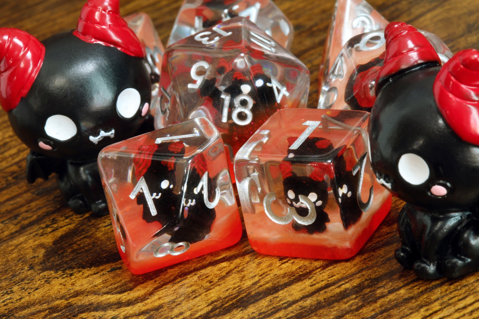 Demonic Cat dice set - Dice set with winged cats on an orange layer - The Wizard's Vault