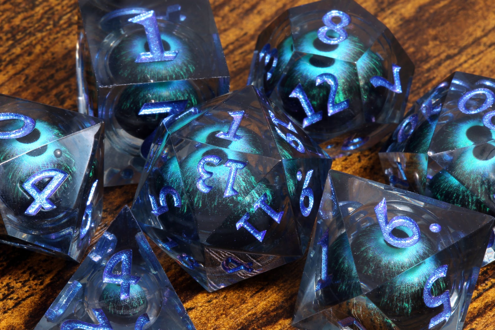 Eye of Veknar dice set - Dark blue Liquid Core sharp edge dice with moving eyes - The Wizard's Vault