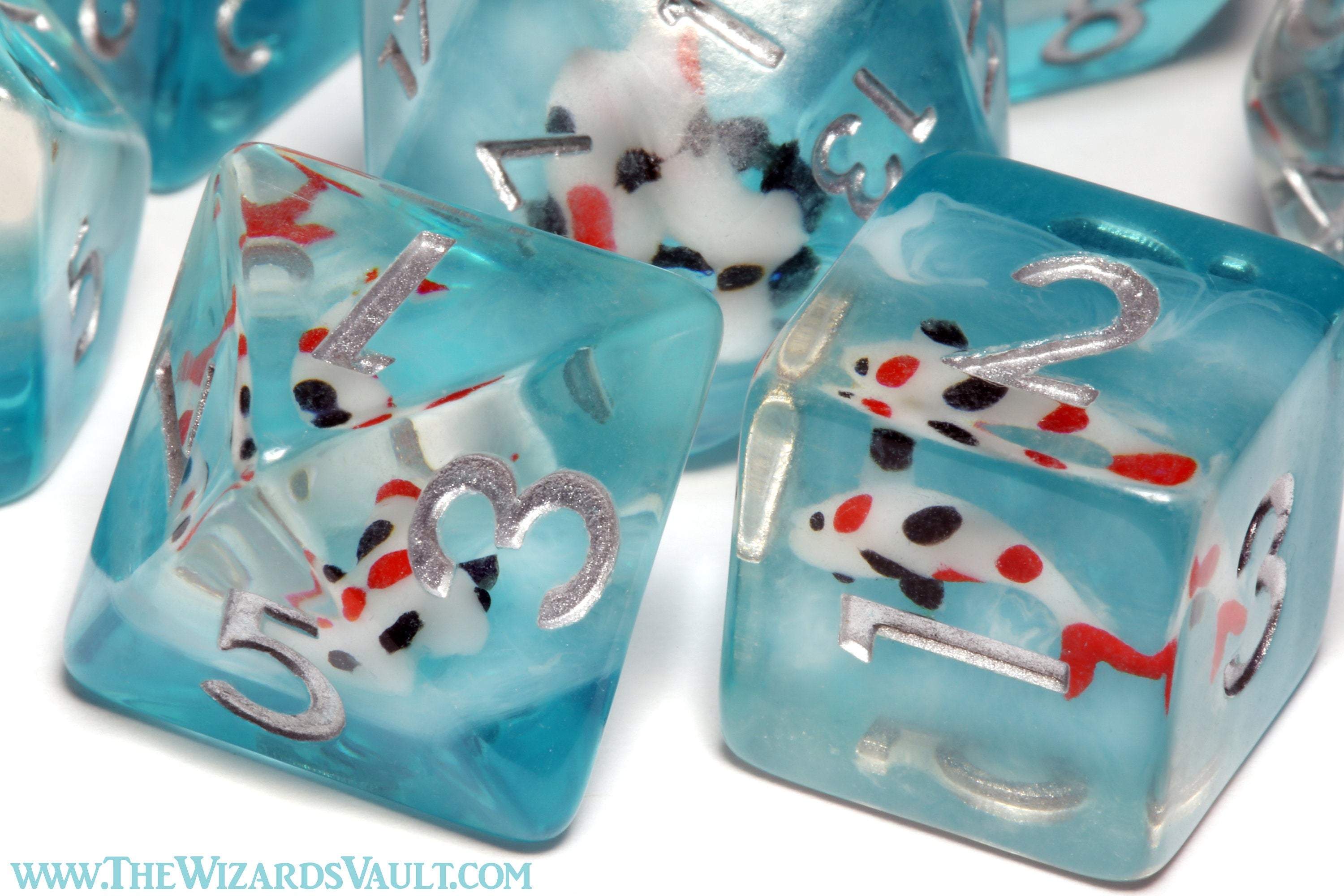 Ocean Koi dice set - DND Dice set with small fish on a blue layer - The Wizard's Vault