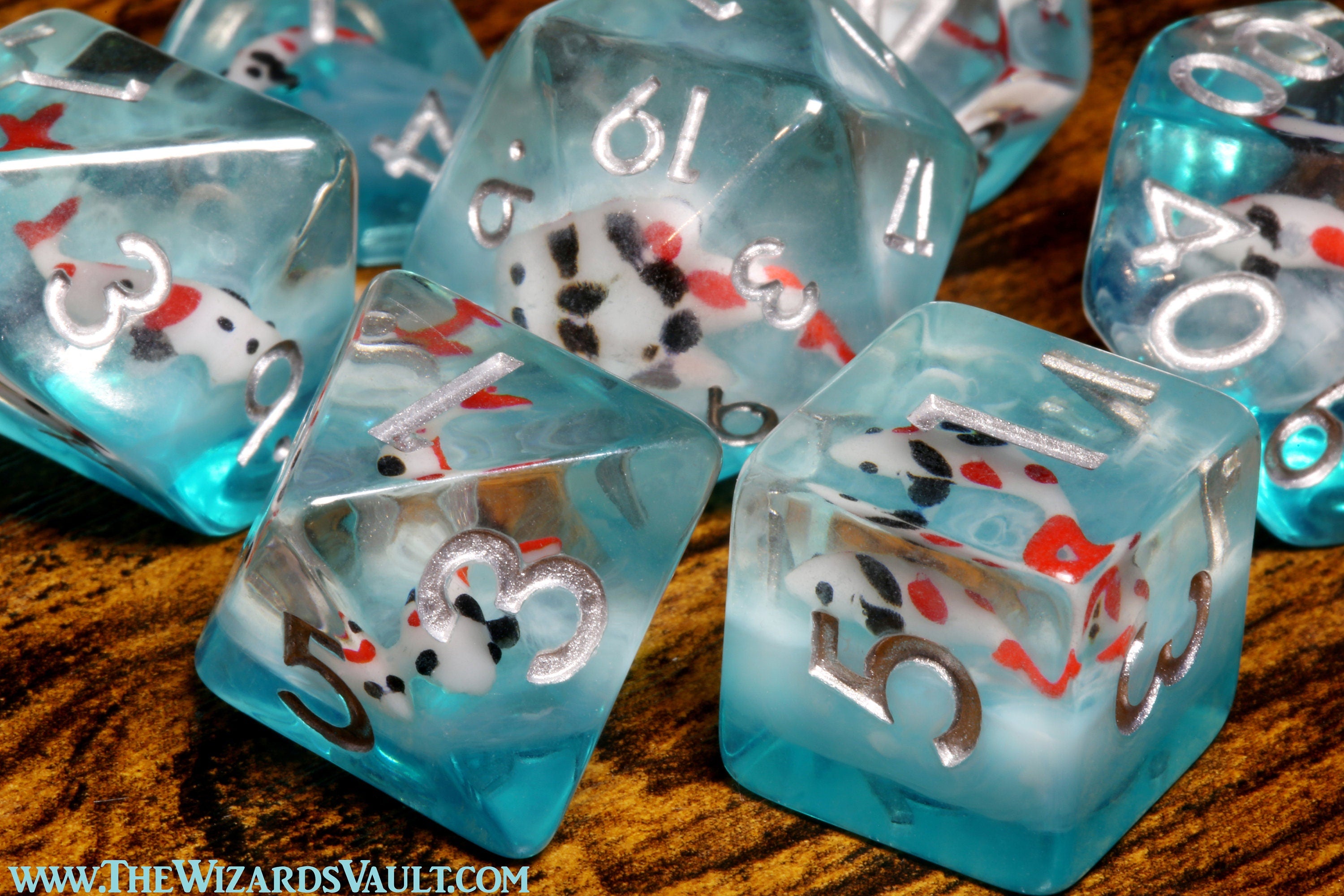 Ocean Koi dice set - DND Dice set with small fish on a blue layer - The Wizard's Vault