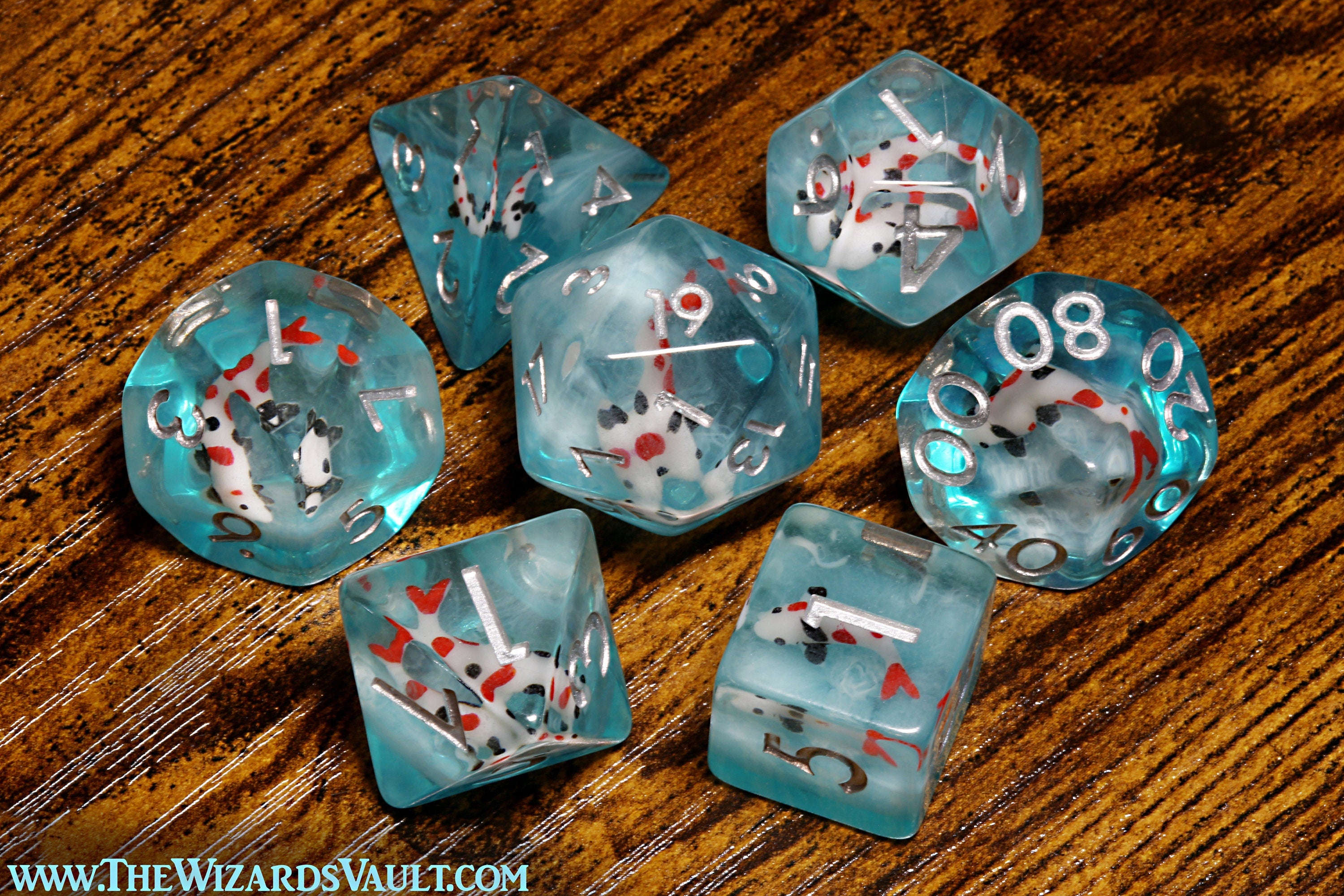 Ocean Koi dice set - DND Dice set with small fish on a blue layer - The Wizard's Vault