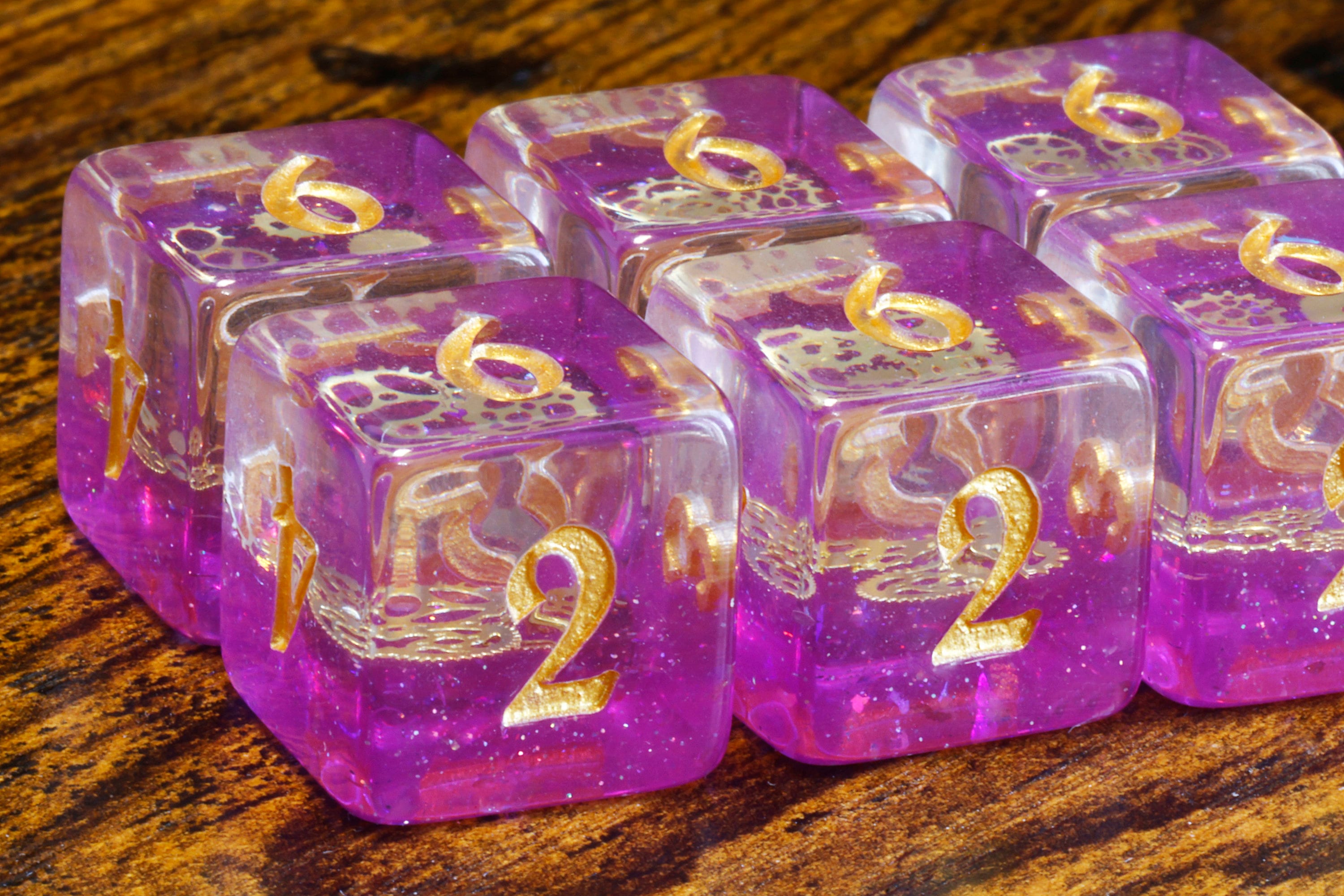 Arcane Sprockets D6 Dice, Purple glittery layer with small golden gear - The Wizard's Vault