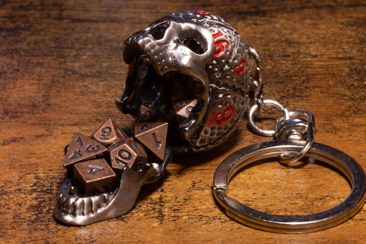 Skull Dice Keeper Keychain – Metal Skull with Miniature 7-Piece Copper Dice Set