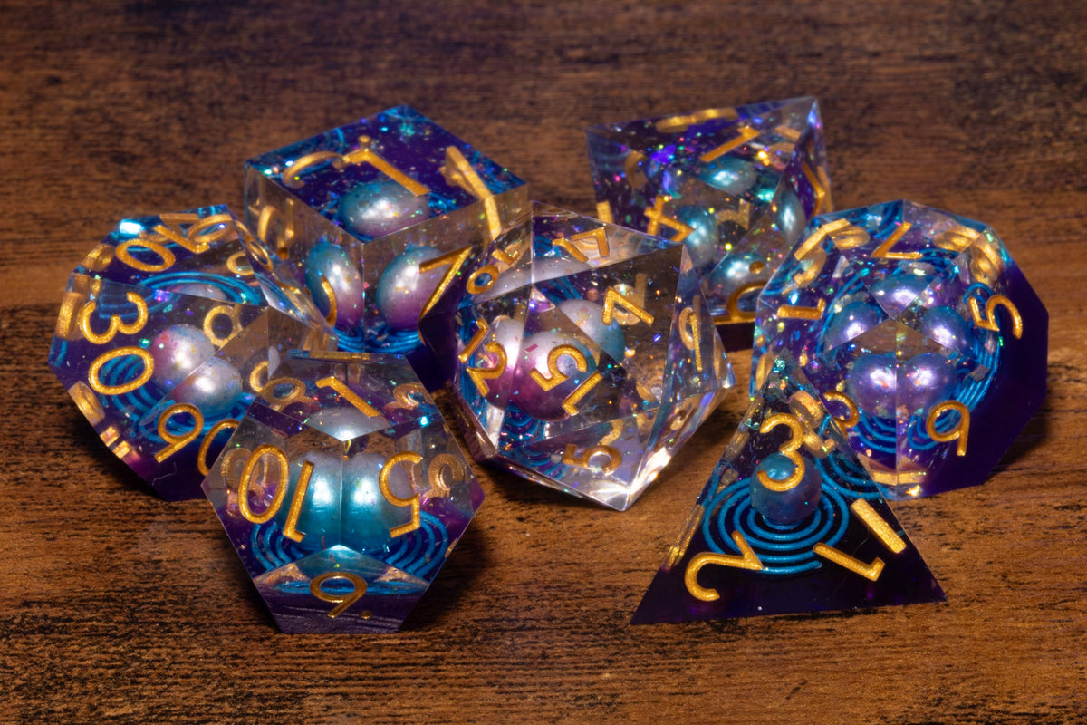 Wandering Star 7-Piece Sharp Edge Dice Set – Clear Iridescent with Planet Inclusion