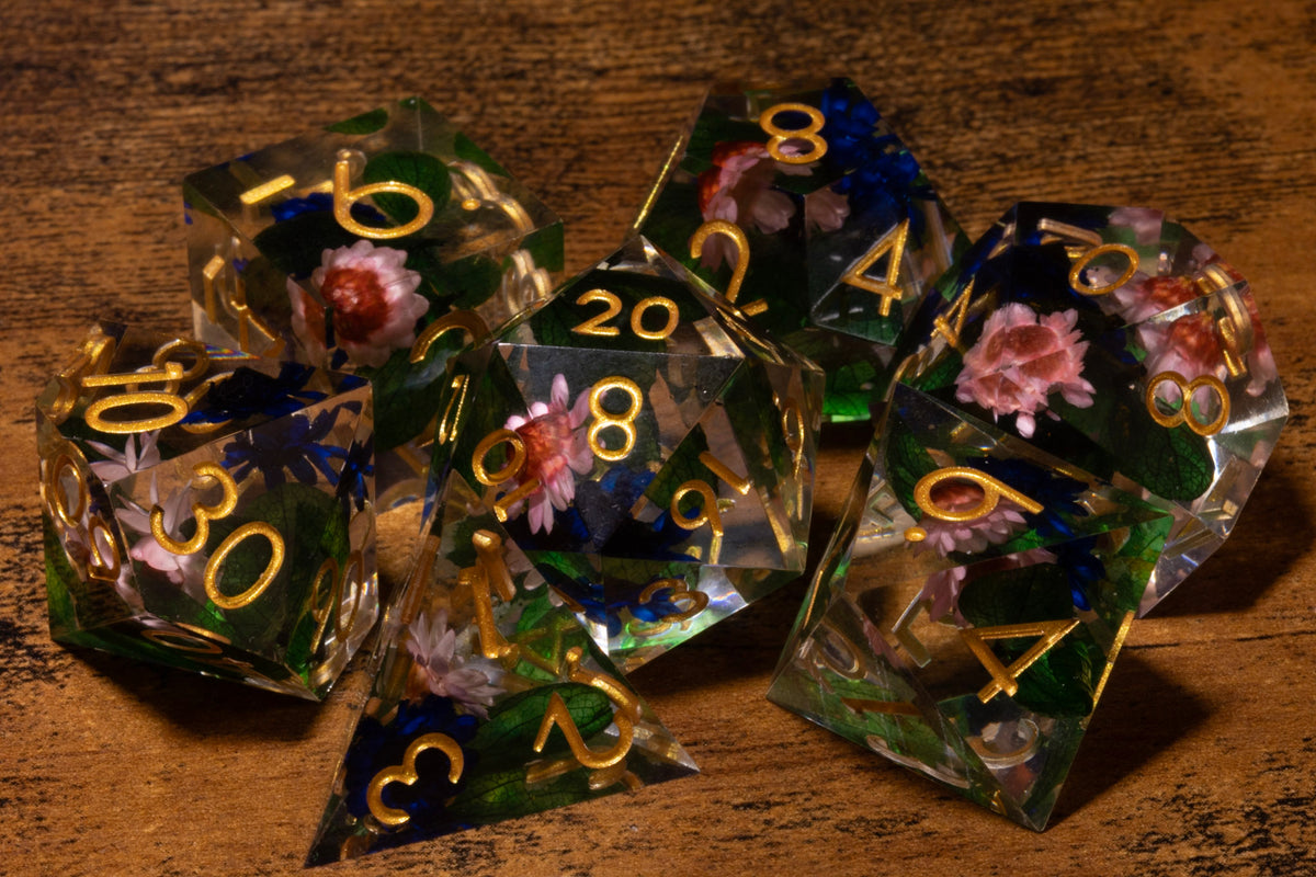 Elderwild 7-Piece Sharp Edge Dice Set – Clear with Pink Blossoms & Blue Petals
