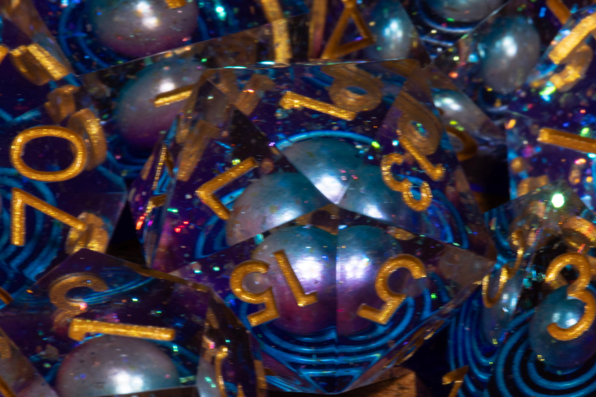 Wandering Star sharp edge dice close-up showing the planet inclusion
