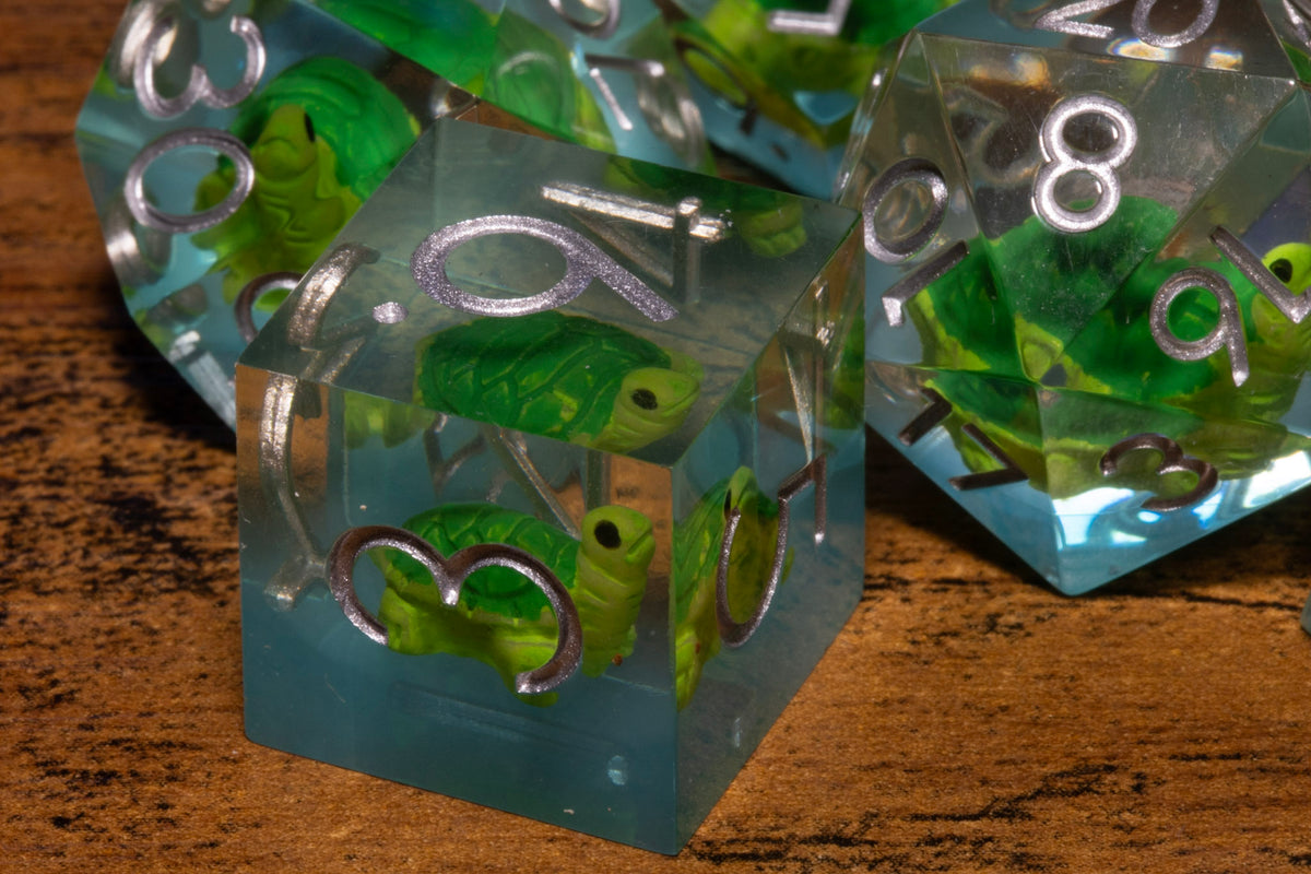 Turtle Cove 7-Piece Sharp Edge Dice Set – Pale Blue with Turtle Inclusions