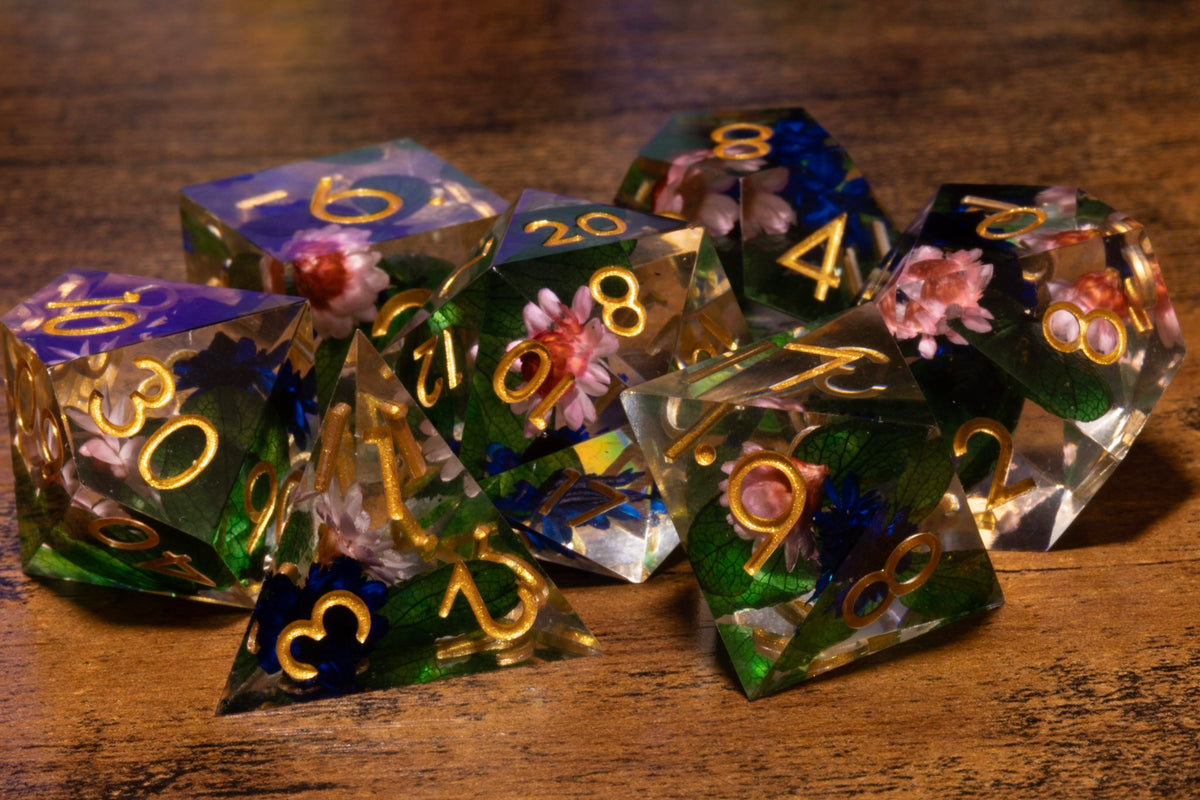 Elderwild 7-Piece Sharp Edge Dice Set – Clear with Pink Blossoms & Blue Petals