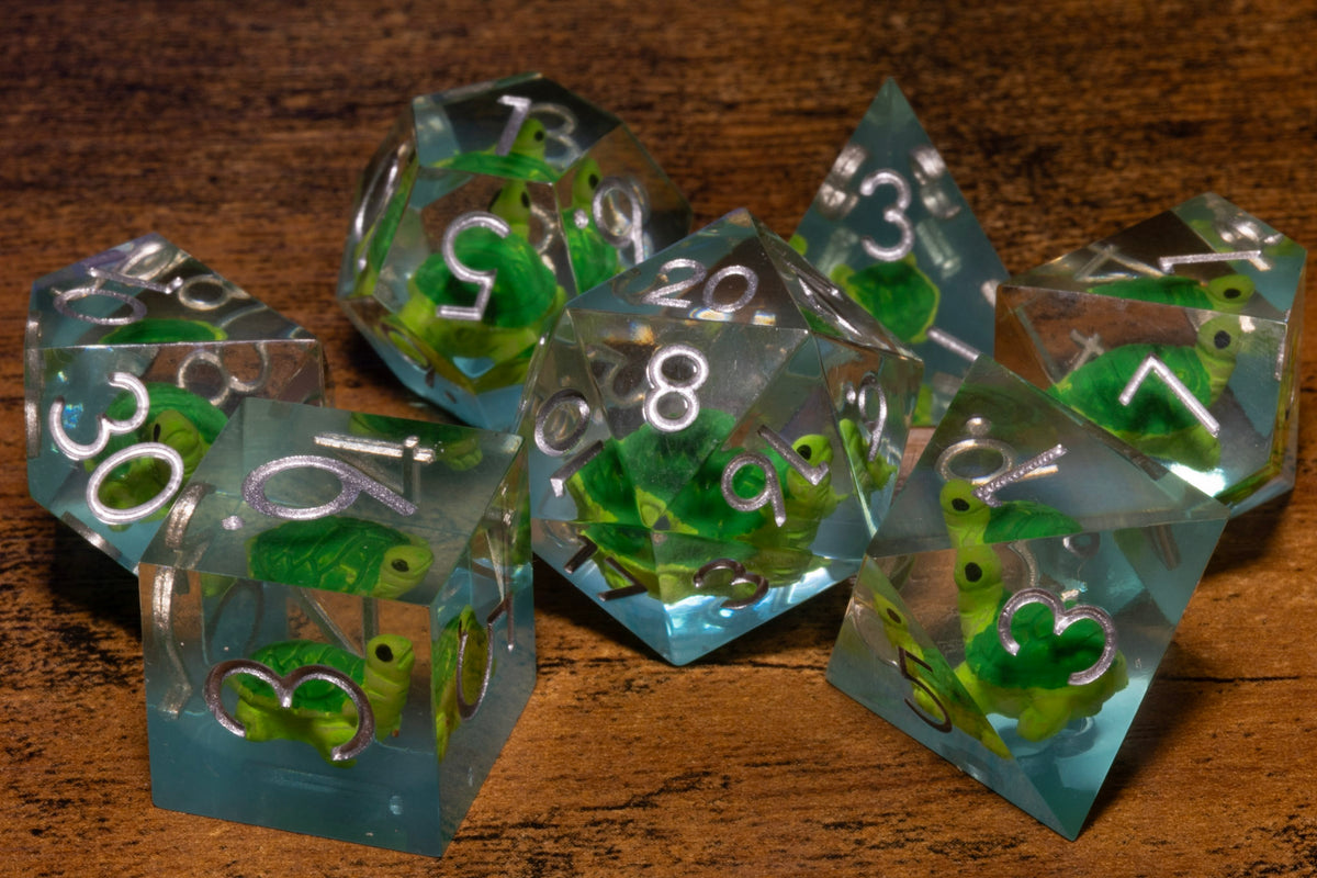 Turtle Cove 7-Piece Sharp Edge Dice Set – Pale Blue with Turtle Inclusions