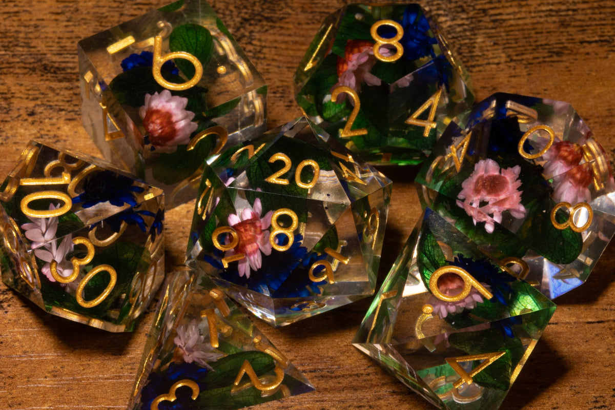 Elderwild 7-Piece Sharp Edge Dice Set – Clear with Pink Blossoms & Blue Petals