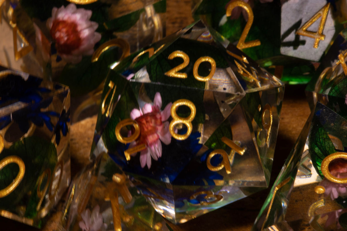 Elderwild 7-Piece Sharp Edge Dice Set – Clear with Pink Blossoms & Blue Petals