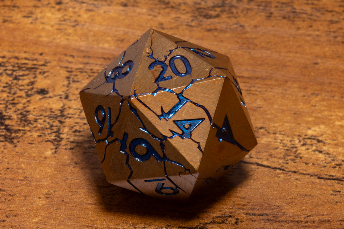 Glacier Shard Metal D20 – Gold with Blue Cracks