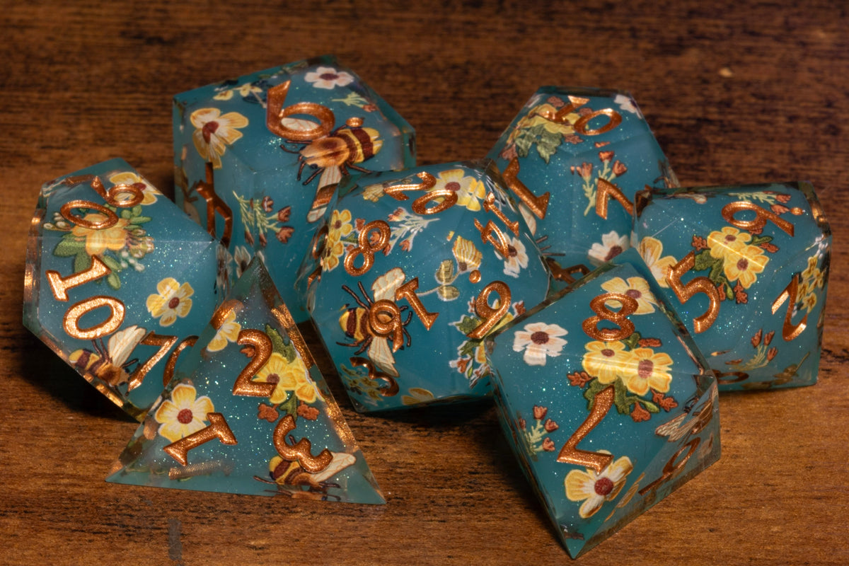 Honey Meadow 7-Piece Sharp Edge Dice Set – Teal with Bee & Wildflower Pattern