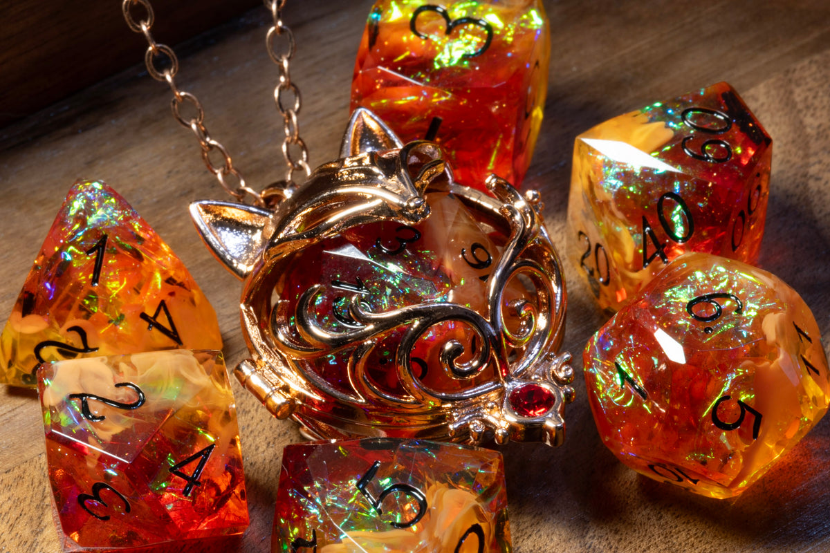 Close-up of the fox pendant in a copper finish holding an Amber Opal D20