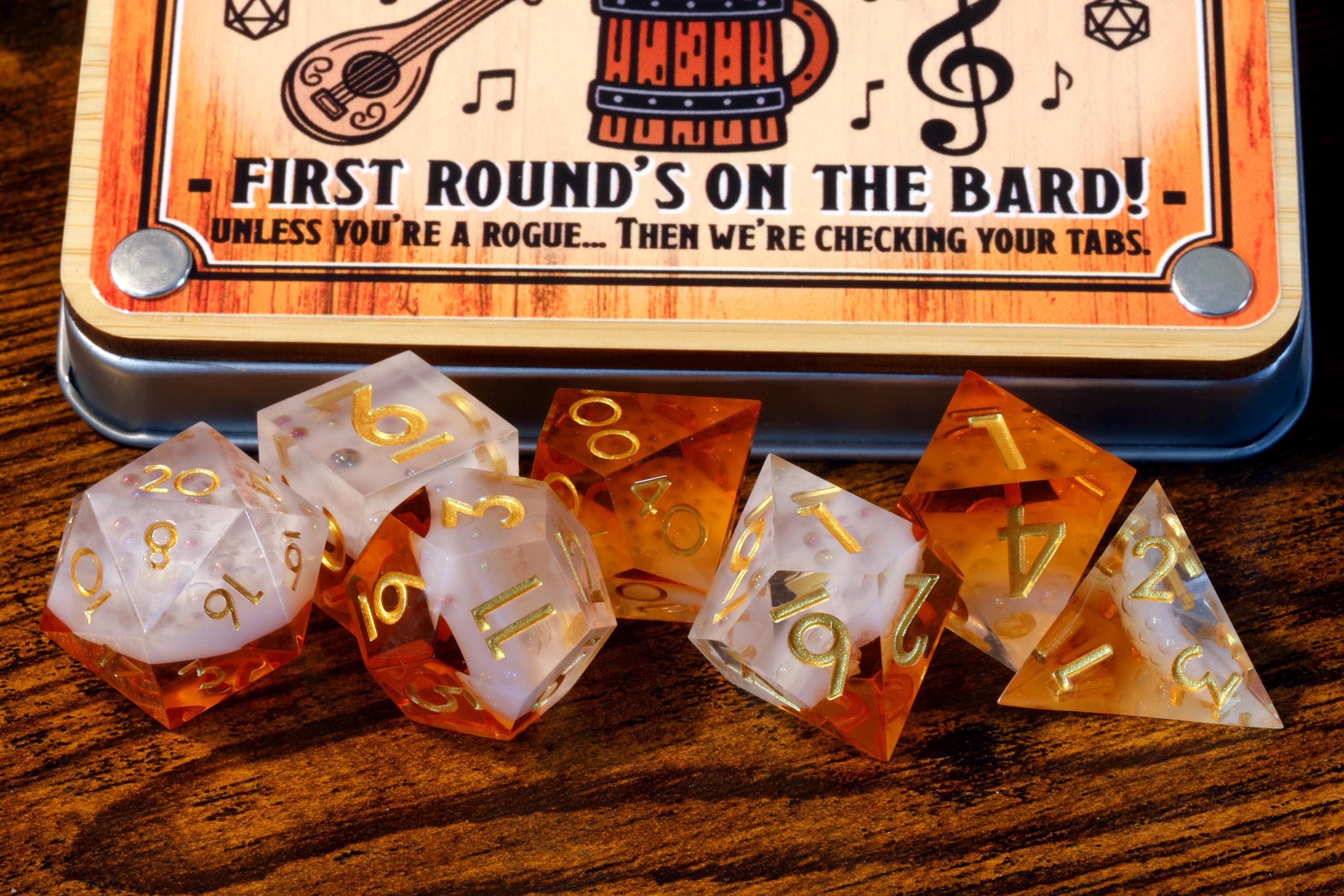 Bard’s Brew 7-piece polyhedral dice set in golden ale tones