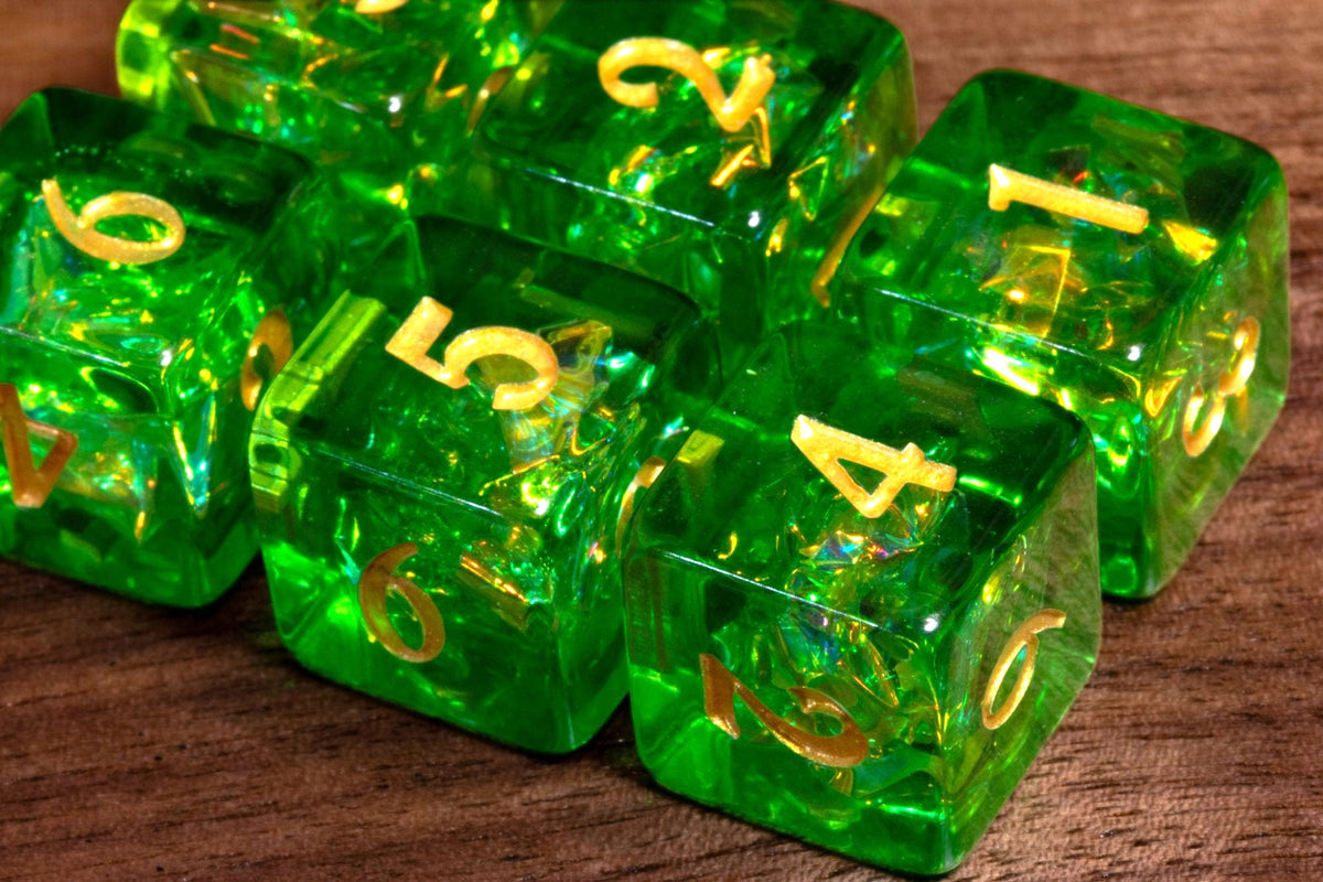 Close-up of Canopy Opal D6 dice, bright green resin with holographic foil and gold numbers