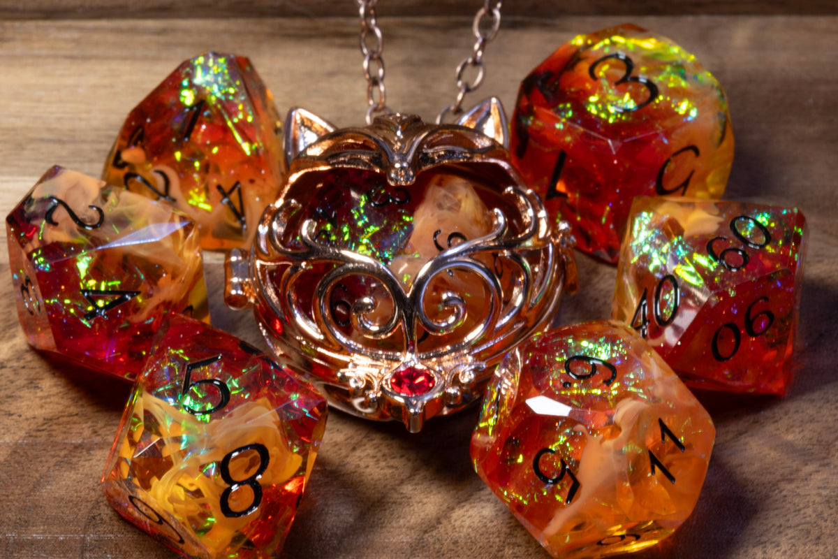Close-up of the fox pendant in a copper finish holding an Amber Opal D20