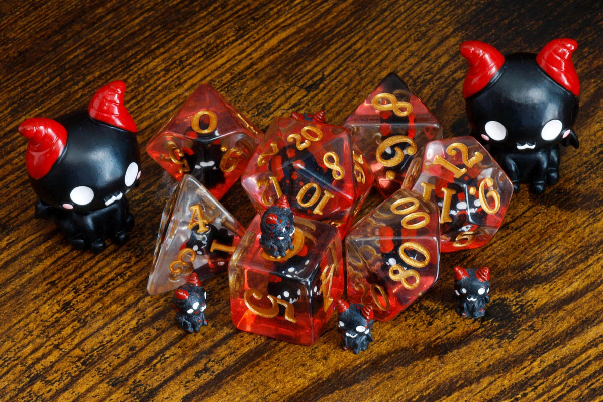 Demonic Cat dice set - winged cats on red layer with gold numbers - The Wizard's Vault