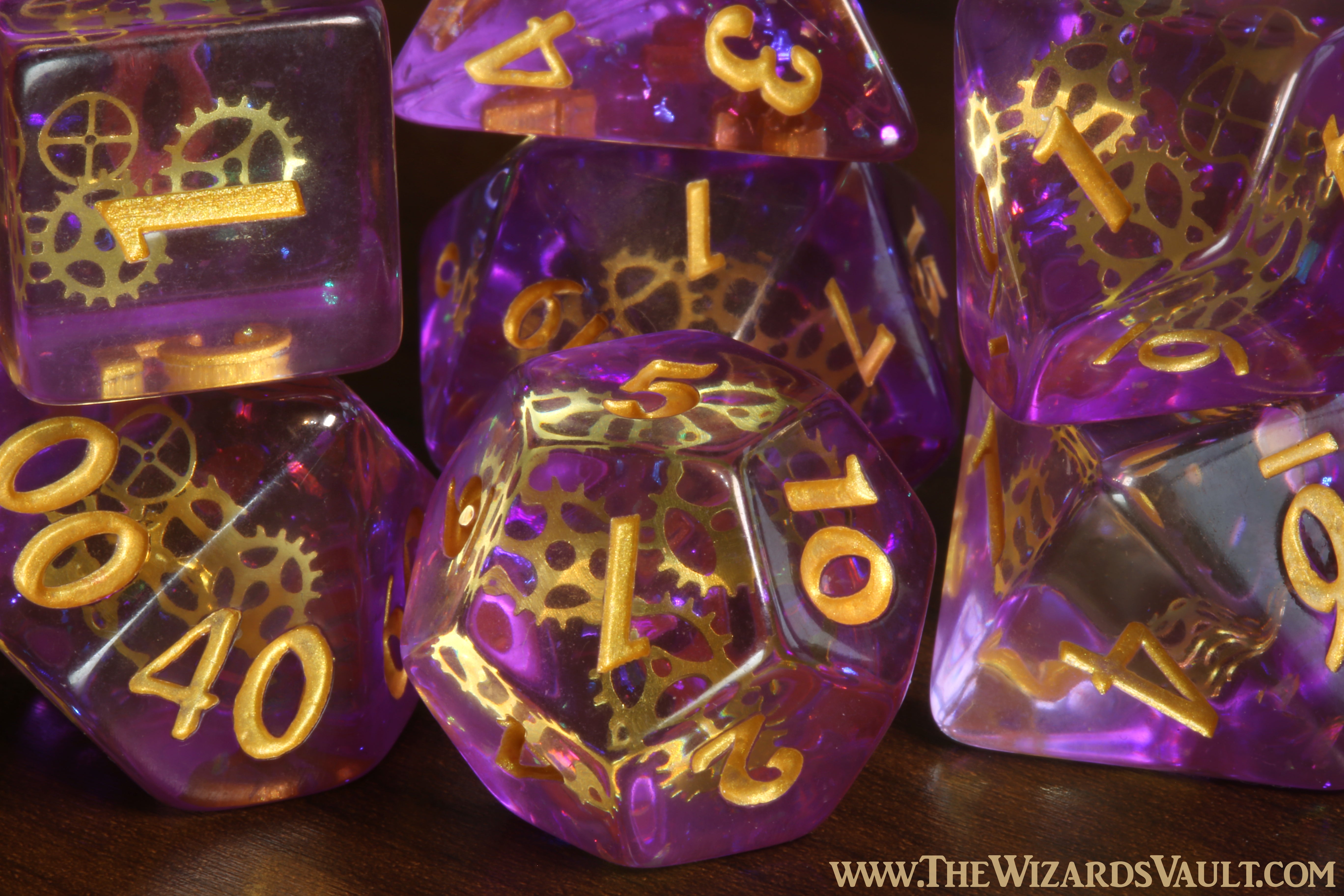 Arcane Sprockets - Dice with tiny golden gears on a purple glittery layer. - The Wizard's Vault