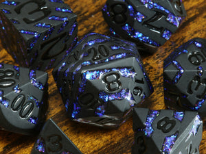 Rift Artifact - Heavy black metal dice with iridescent blue stripe - The Wizard's Vault