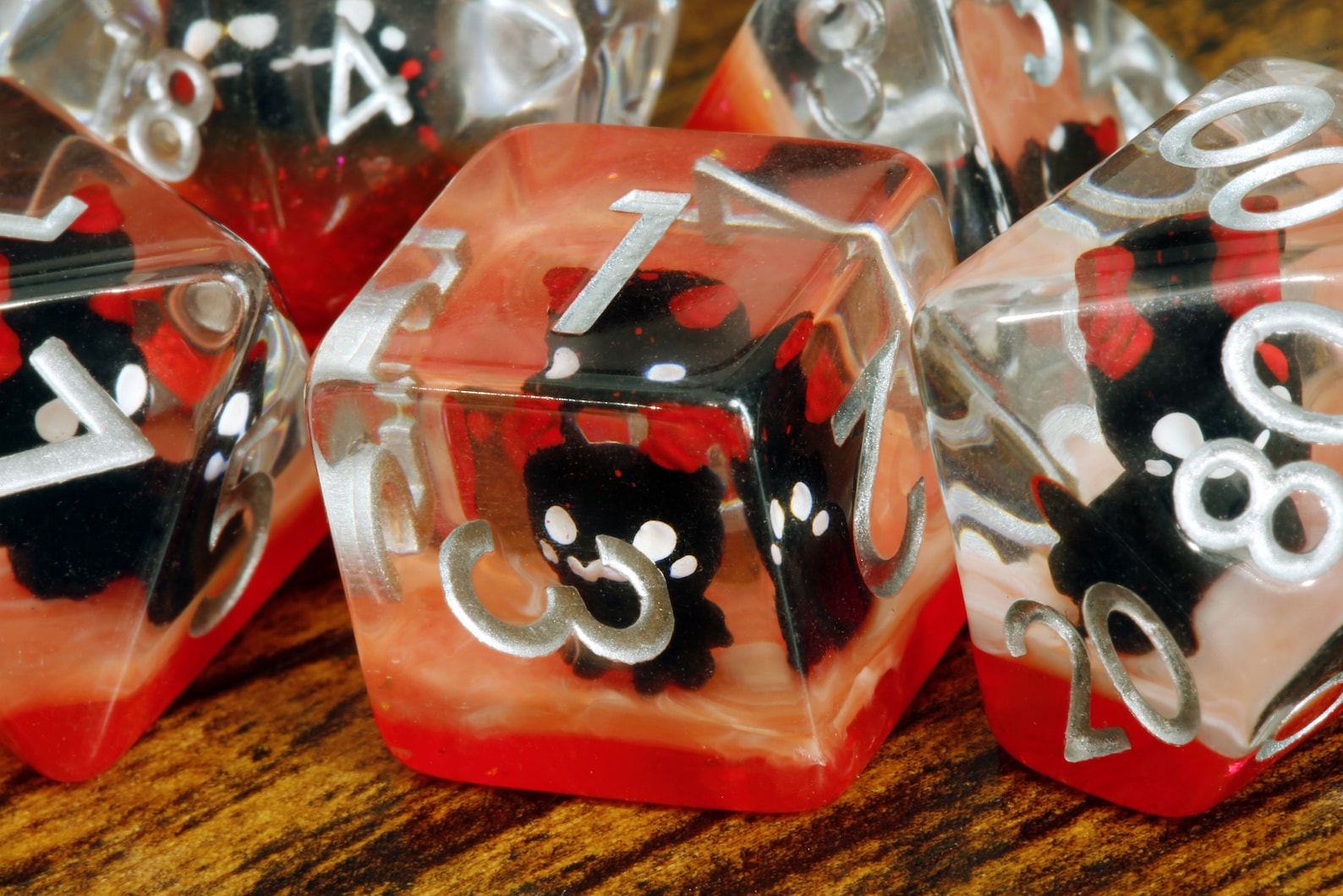 Demonic Cat dice set - Dice set with winged cats on an orange layer - The Wizard's Vault