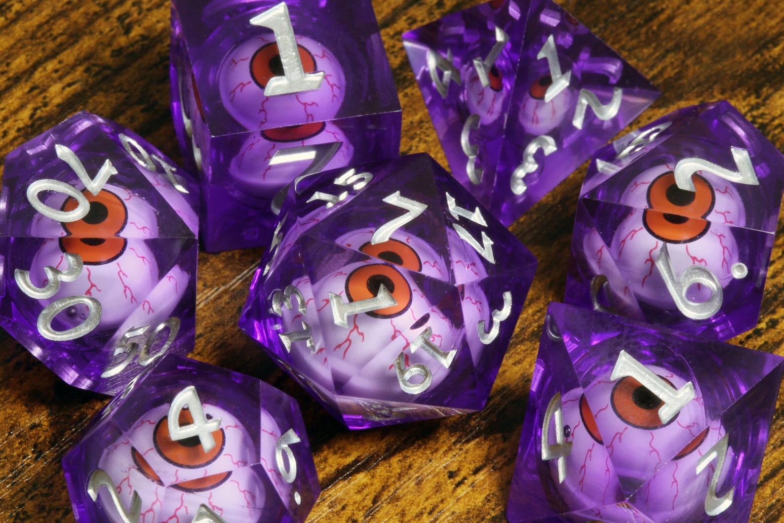 Eldritch Gaze dice set - Purple Liquid Core sharp edge dice with moving eyes - The Wizard's Vault