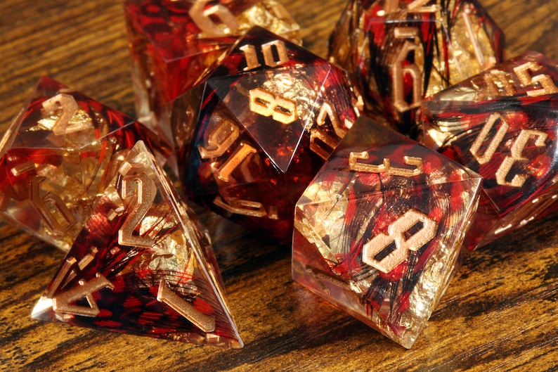 Phoenix Rising dice set - Red feather sharp edge dice set with gold flakes - The Wizard's Vault