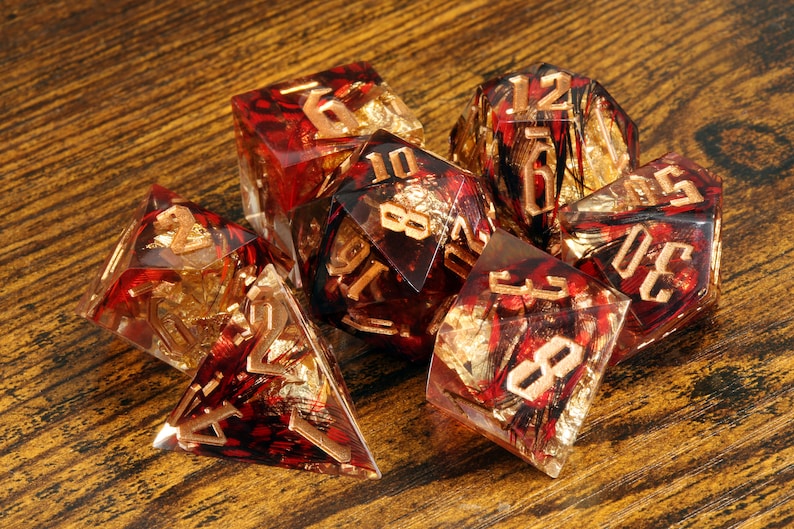 Phoenix Rising dice set - Red feather sharp edge dice set with gold flakes - The Wizard's Vault