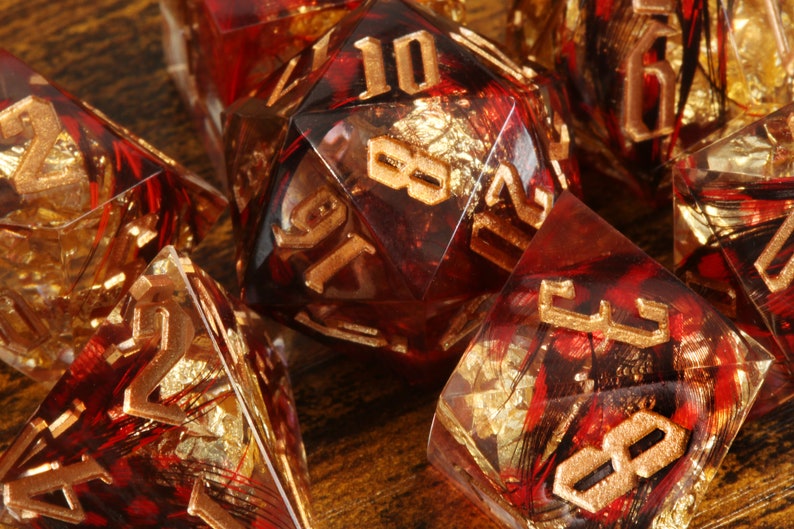 Phoenix Rising dice set - Red feather sharp edge dice set with gold flakes - The Wizard's Vault