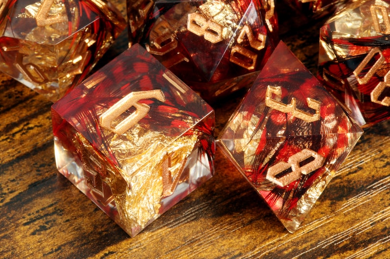 Phoenix Rising dice set - Red feather sharp edge dice set with gold flakes - The Wizard's Vault