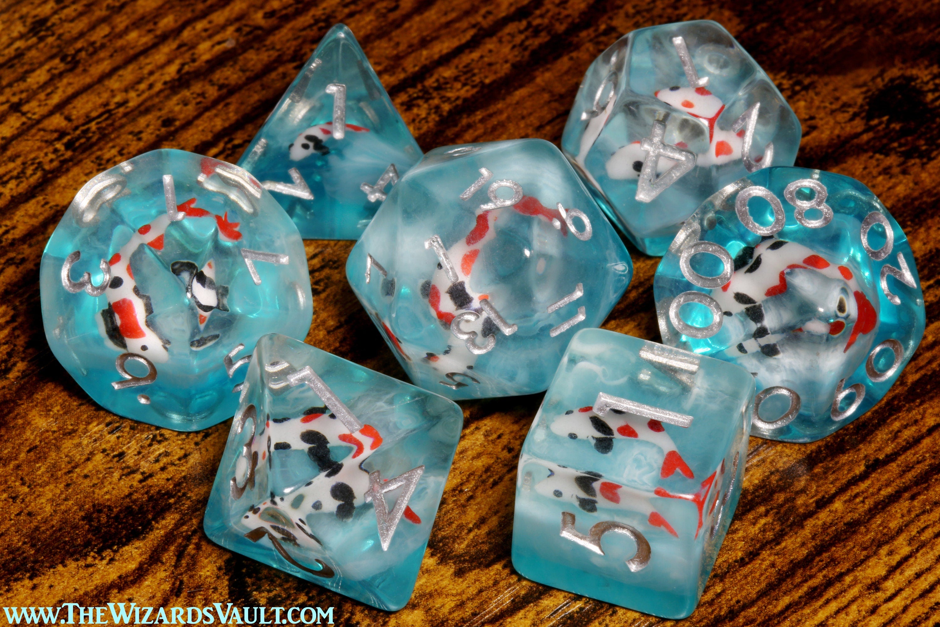 Ocean Koi dice set - DND Dice set with small fish on a blue layer - The Wizard's Vault