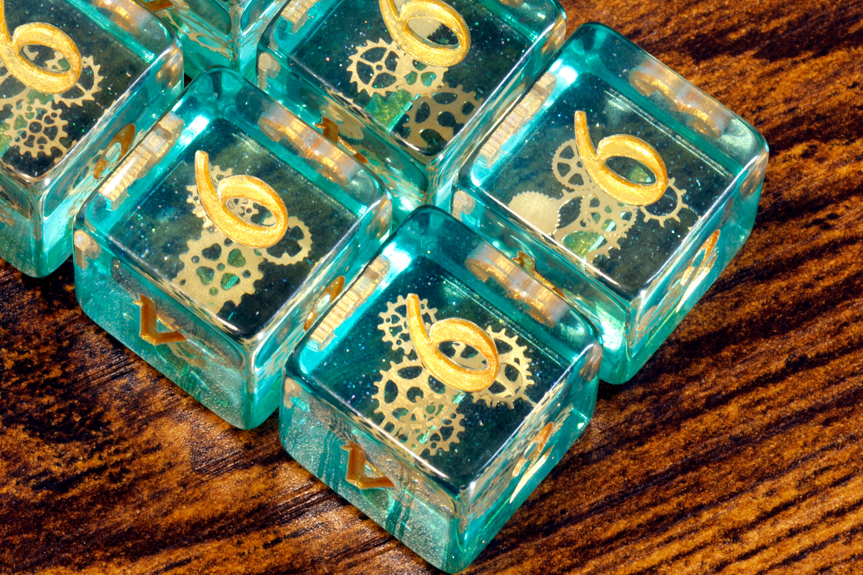 Ethereal Sprockets D6 Dice, Blue green glittery layer with small golden gear inclusions